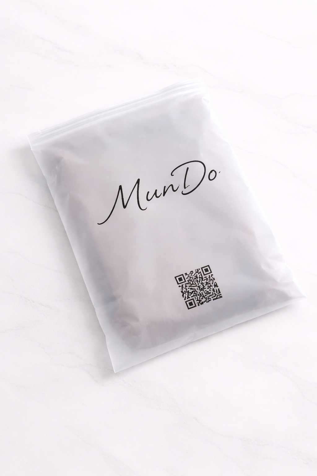 white zipper bag printed with Mundo logo and QR code using PrintyPocket handheld inkjet printer