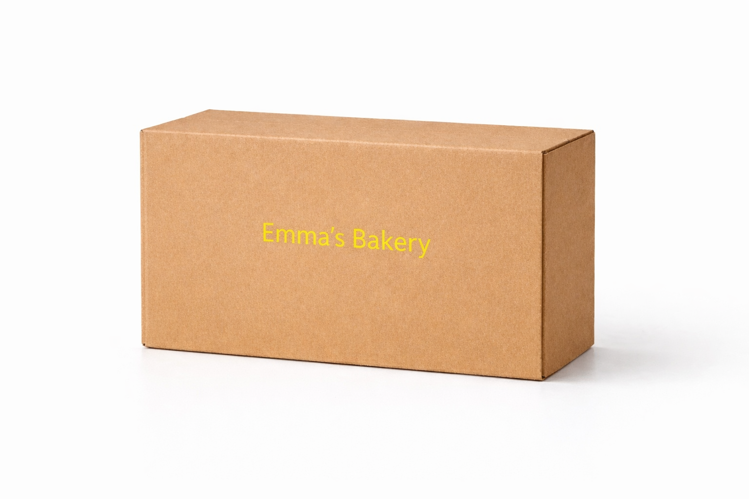 brown box printed with Emma's Bakery brand name in yellow using PrintyPocket handheld printer